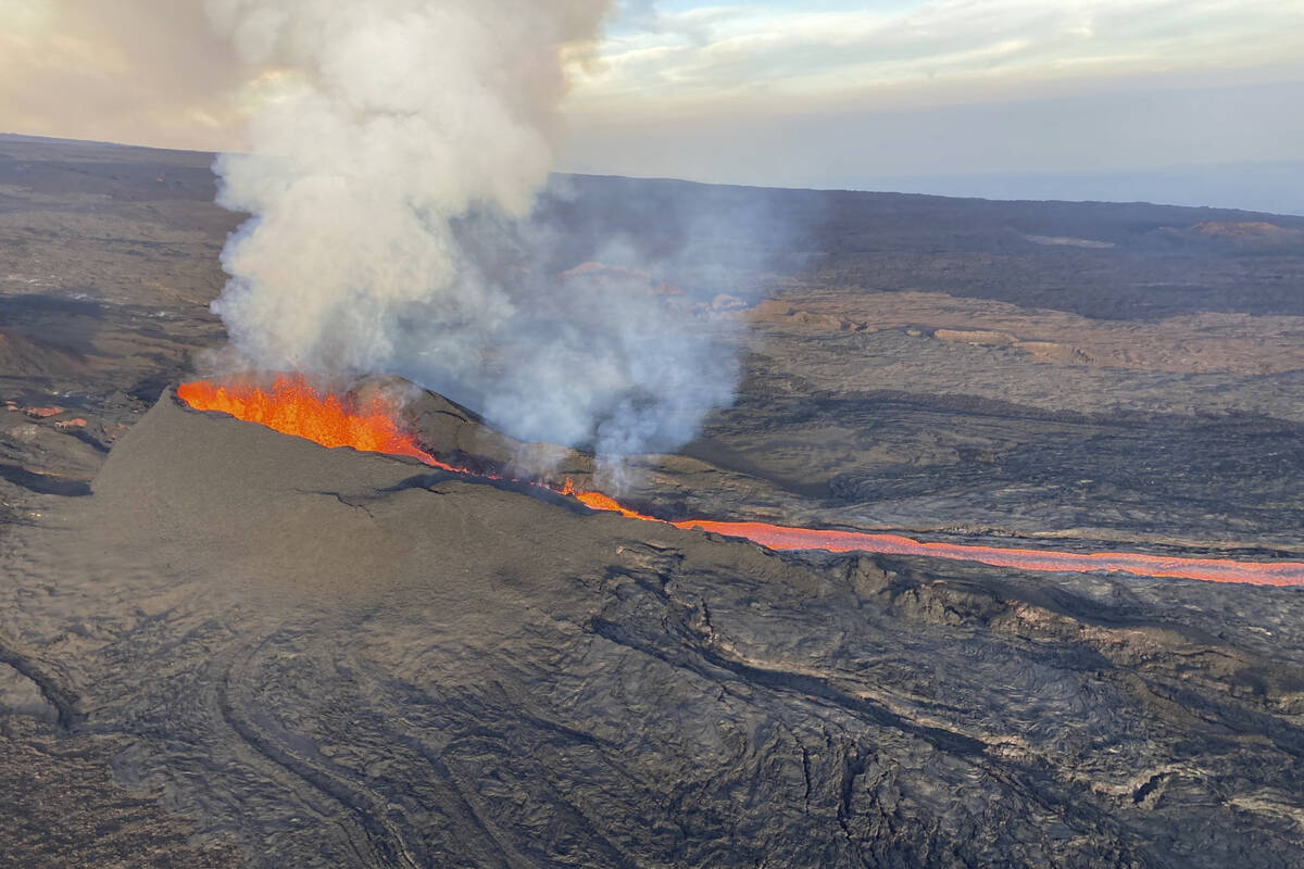 In this aerial image provided by the U.S. Geological Survey, fissure 3 is seen erupting on the ...