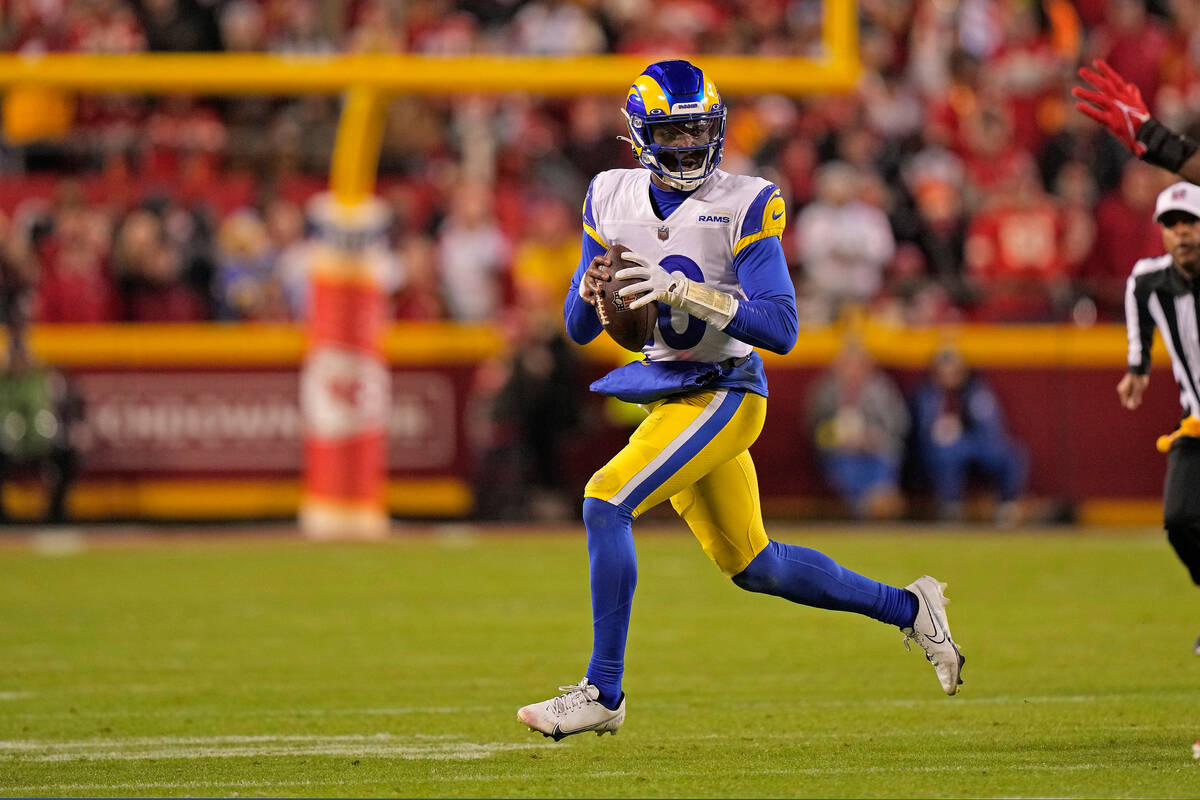 Los Angeles Rams quarterback Bryce Perkins looks to pass during the first half of an NFL footba ...