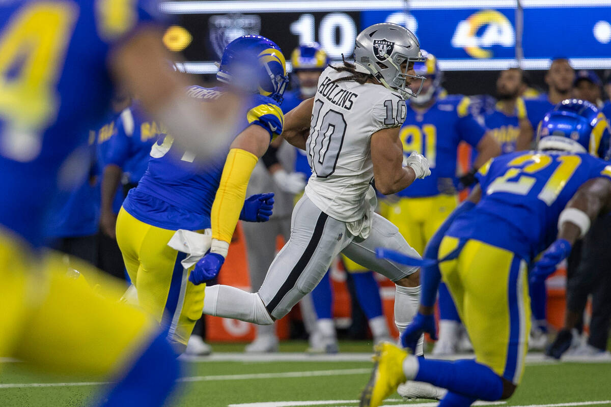 Raiders wide receiver Mack Hollins (10) runs as Los Angeles Rams defensive tackle Michael Hoech ...