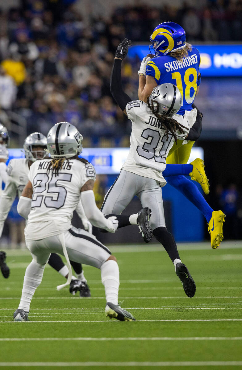 Los Angeles Rams wide receiver Ben Skowronek (18) makes a catch over Raiders cornerback Sidney ...