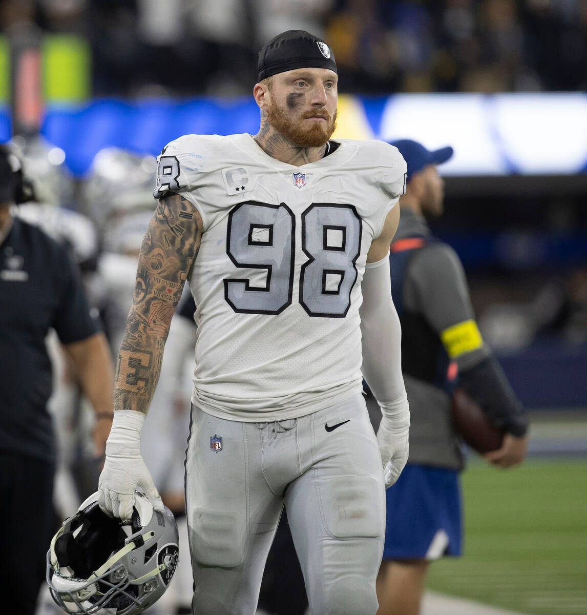 Raiders defensive end Maxx Crosby (98) prepares to go back on the field after the against the L ...