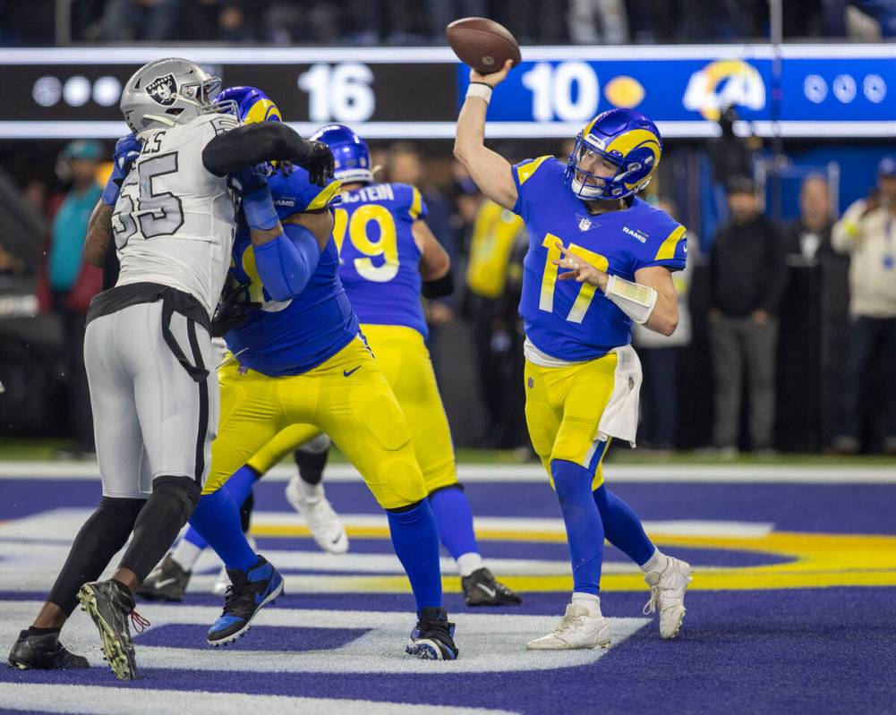 Los Angeles Rams quarterback Baker Mayfield (17) throws as Raiders defensive end Chandler Jones ...