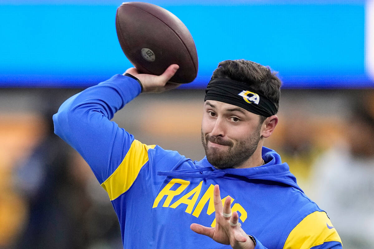 Los Angeles Rams quarterback Baker Mayfield warms up before an NFL football game against the Lo ...