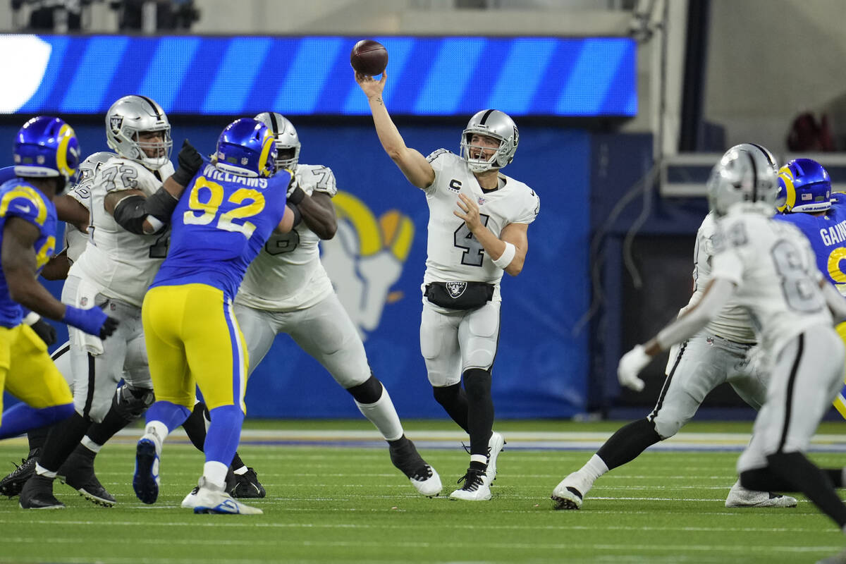 Las Vegas Raiders quarterback Derek Carr throws a pass during the second half of an NFL footbal ...