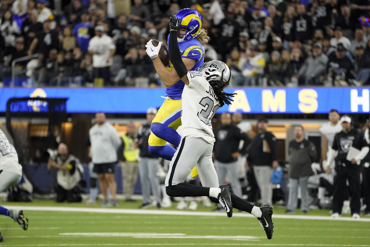Los Angeles Rams wide receiver Ben Skowronek, above, makes a catch as Las Vegas Raiders cornerb ...