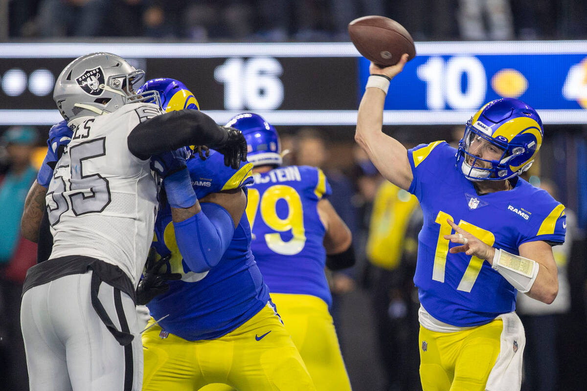 Los Angeles Rams quarterback Baker Mayfield (17) throws as Raiders defensive end Chandler Jones ...