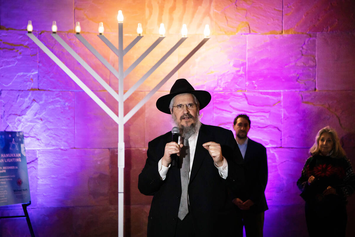Rabbi Shea Harlig speaks during a menorah lighting in the rotunda of the government center on W ...