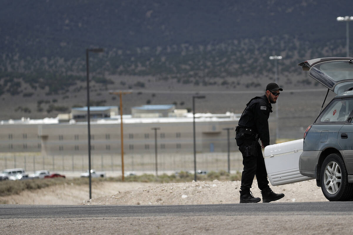 A corrections officer packs up a check point near the entrance to Ely State Prison. (AP Photo/J ...
