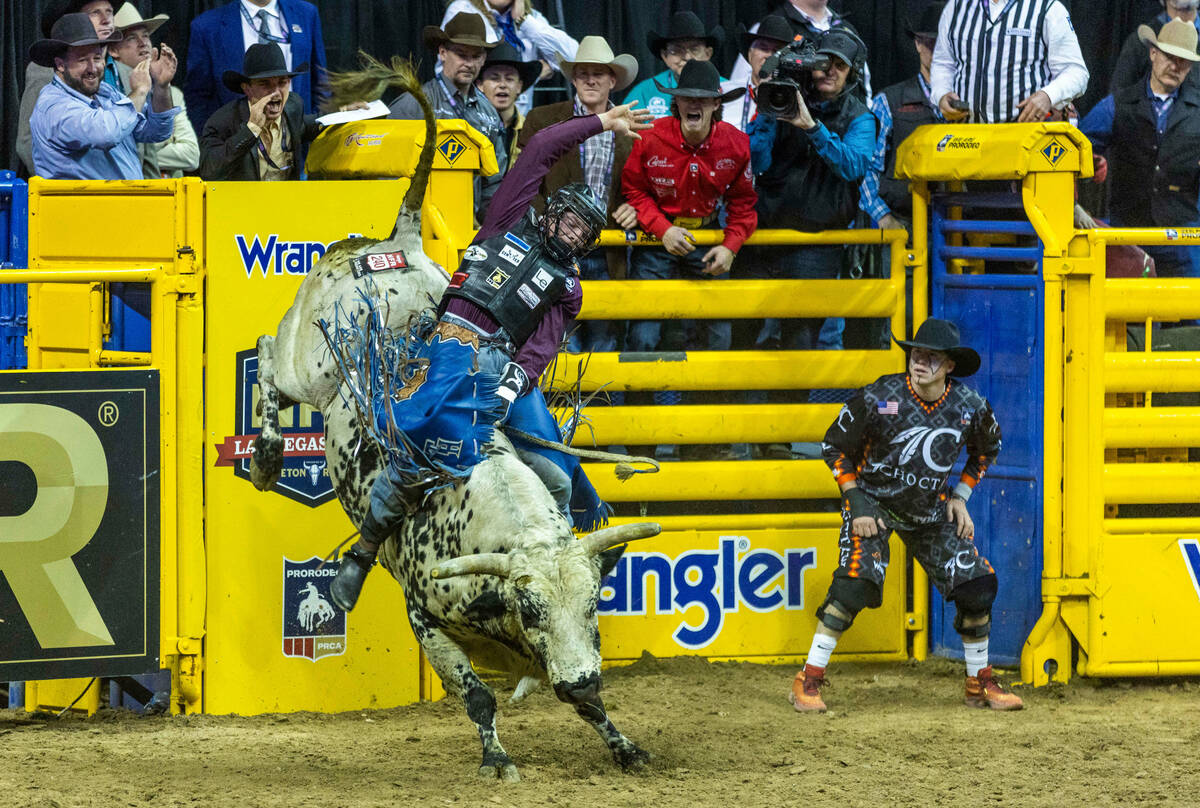 Tristen Hutchings of Monteview, ID., hangs tight on his ride in Bull Riding during the National ...