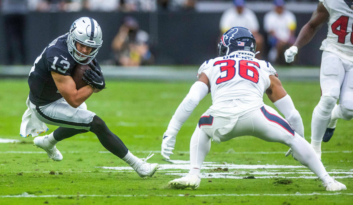 Raiders wide receiver Hunter Renfrow (13) looks to cut up field after a catch with Houston Texa ...