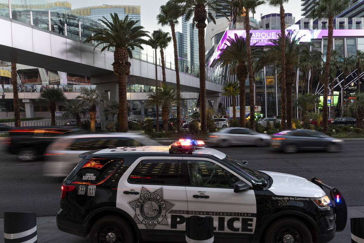 Las Vegas police patrol the Strip outside Planet Hollywood Resort on Tuesday, Aug. 2, 2022. (El ...