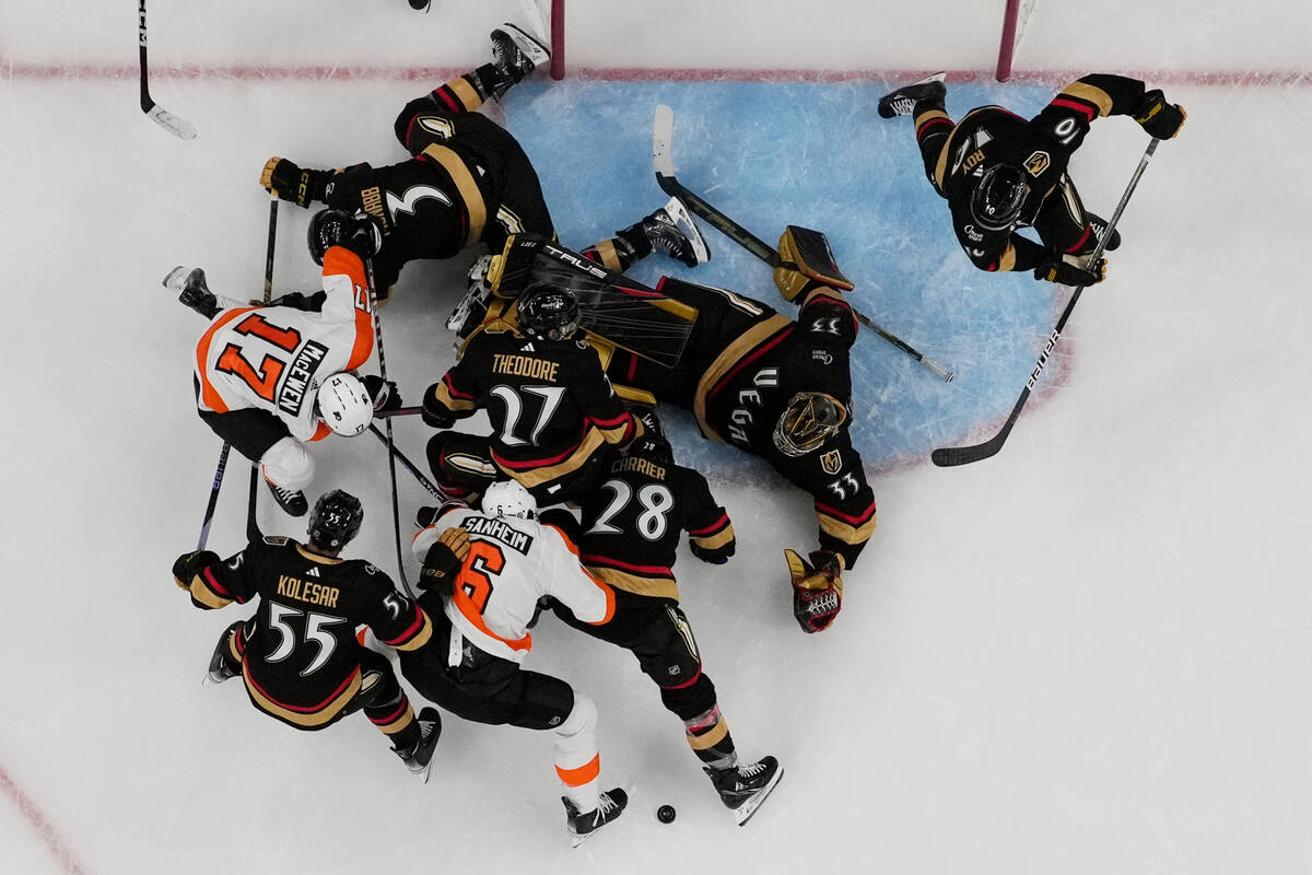 Vegas Golden Knights goaltender Adin Hill (33) stops a shot by the Philadelphia Flyers during t ...