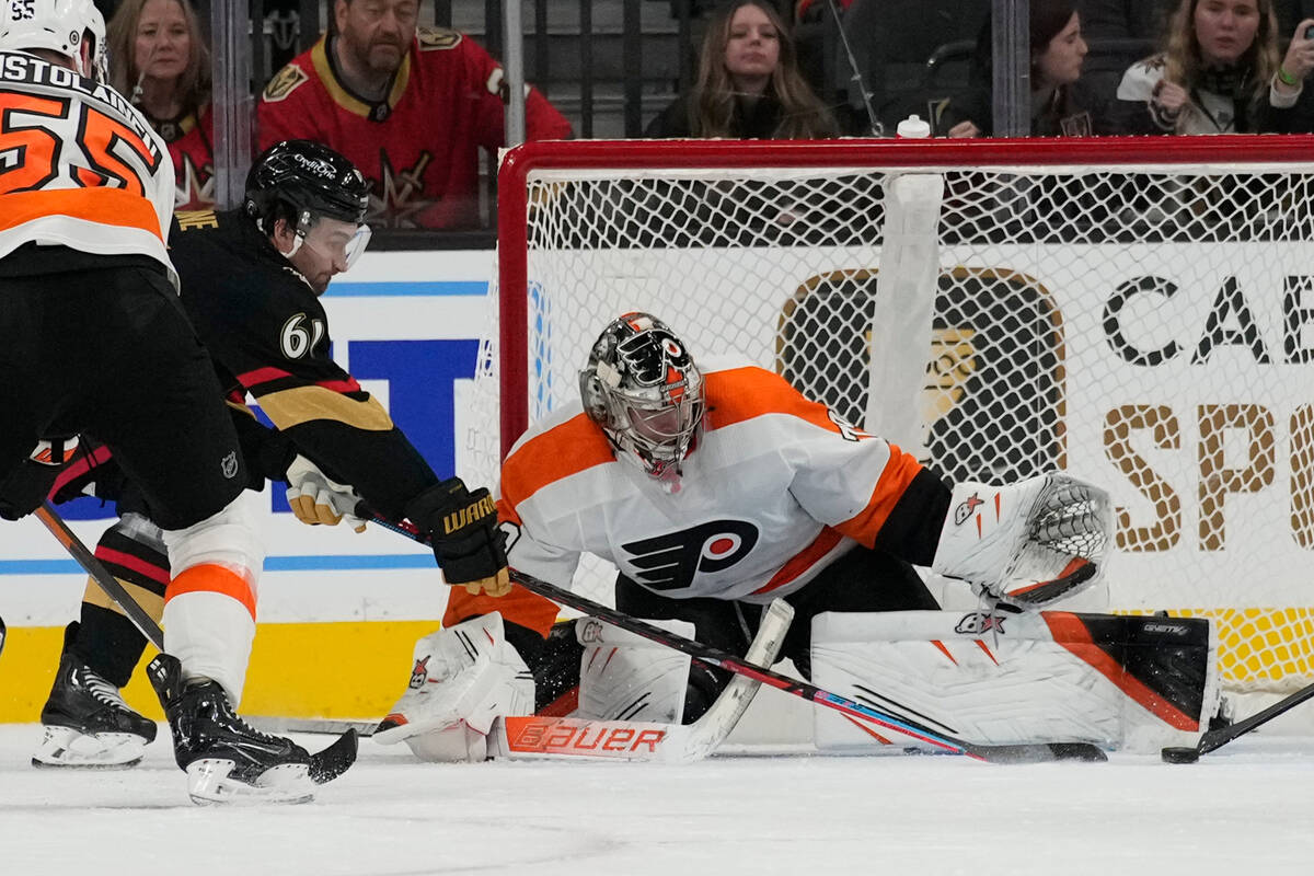 Philadelphia Flyers goaltender Carter Hart (79) blocks an attempted shot by Vegas Golden Knight ...