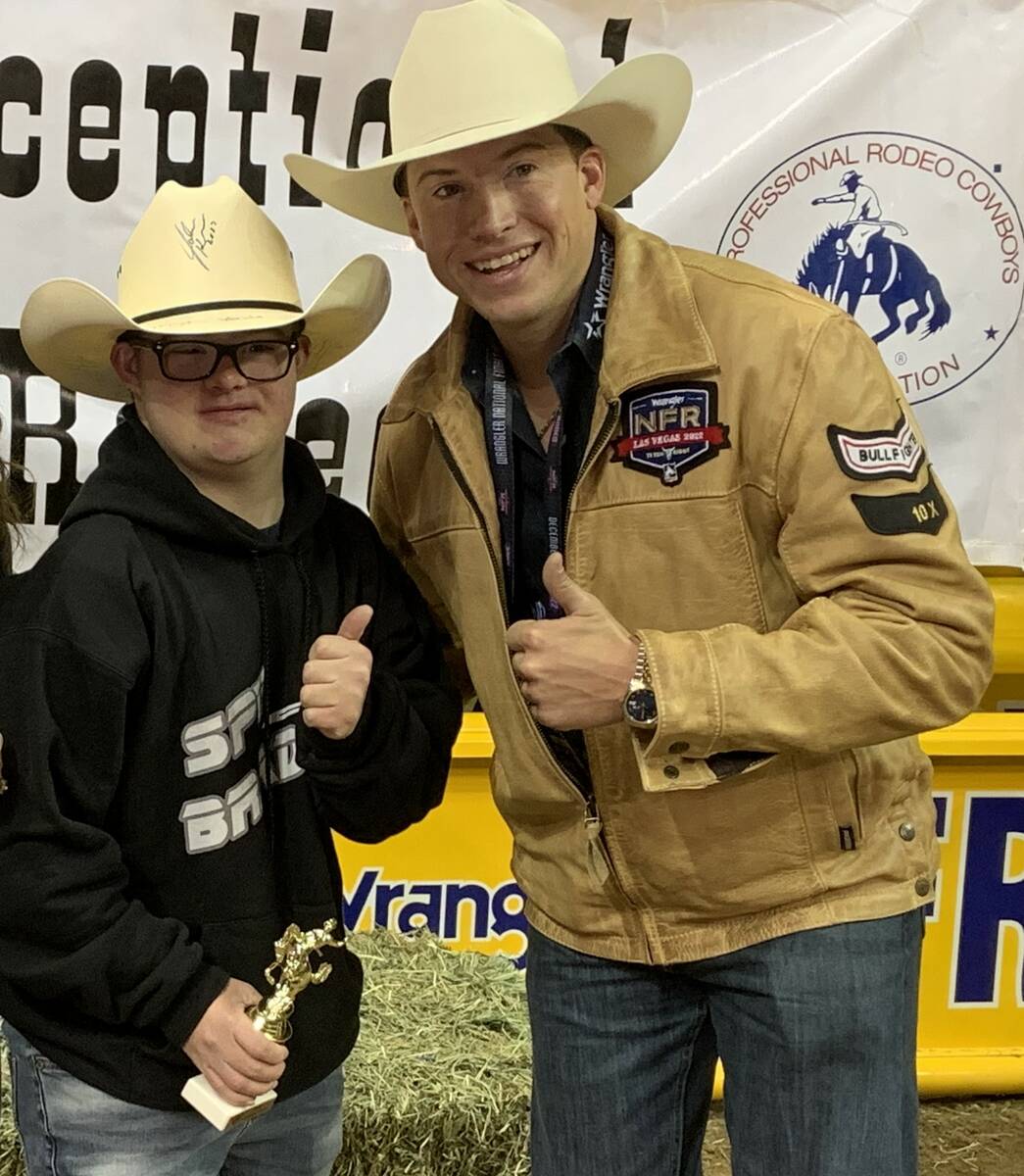 Wrangler NFR bullfighter Cody Webster, right, and his partner Braden Braunlich give the thumbs- ...