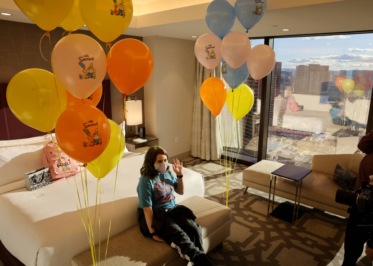 Harli Hecht, 10, who suffers from rare autoimmune conditions, reacts to seeing her hotel room w ...