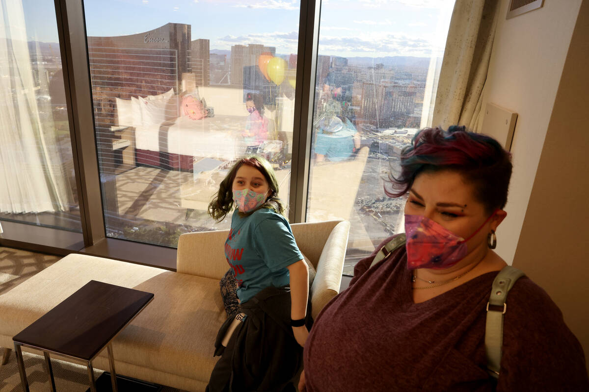 Harli Hecht, 10, who suffers from rare autoimmune conditions, reacts to seeing her hotel room w ...