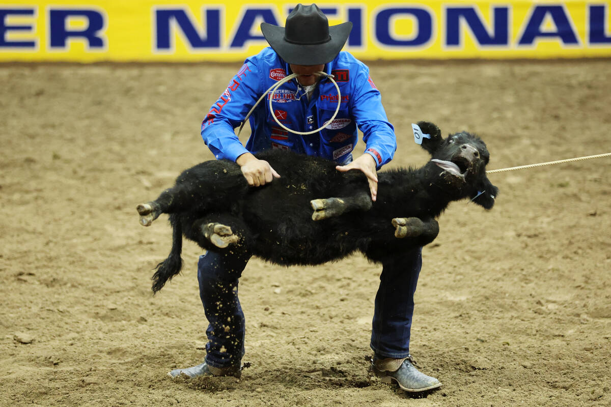 Shad Mayfield competes in the tie-down roping event during the 64th Wrangler National Finals Ro ...