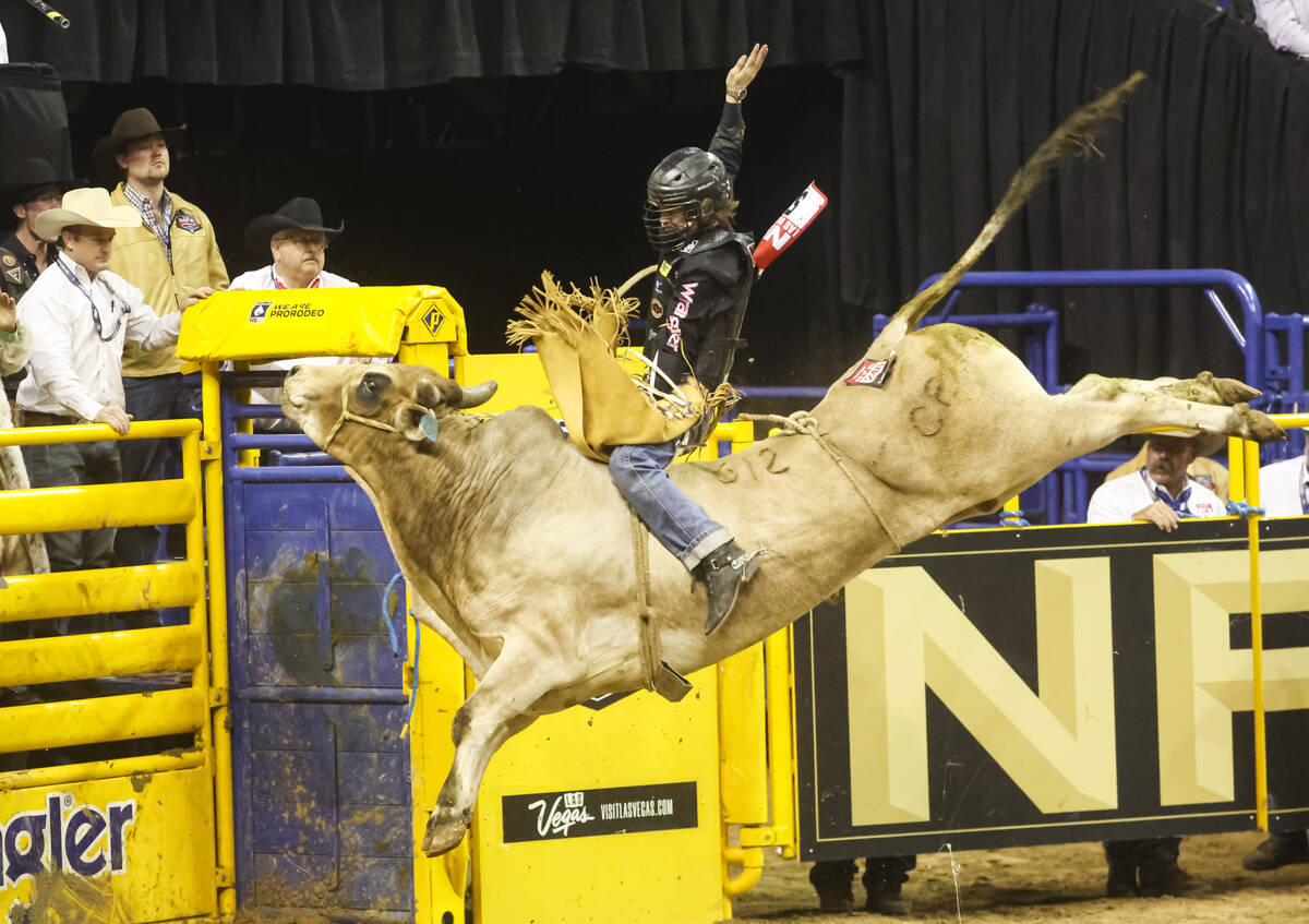 Maverick Potter, of Waxahachie, Texas, rides Ridin’ Solo while competing in bull riding ...