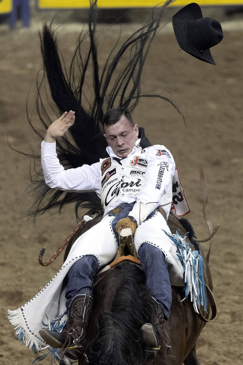 Tim O’Connell, of Zwingle, Iowa, competes in bareback riding during the seventh go-round ...
