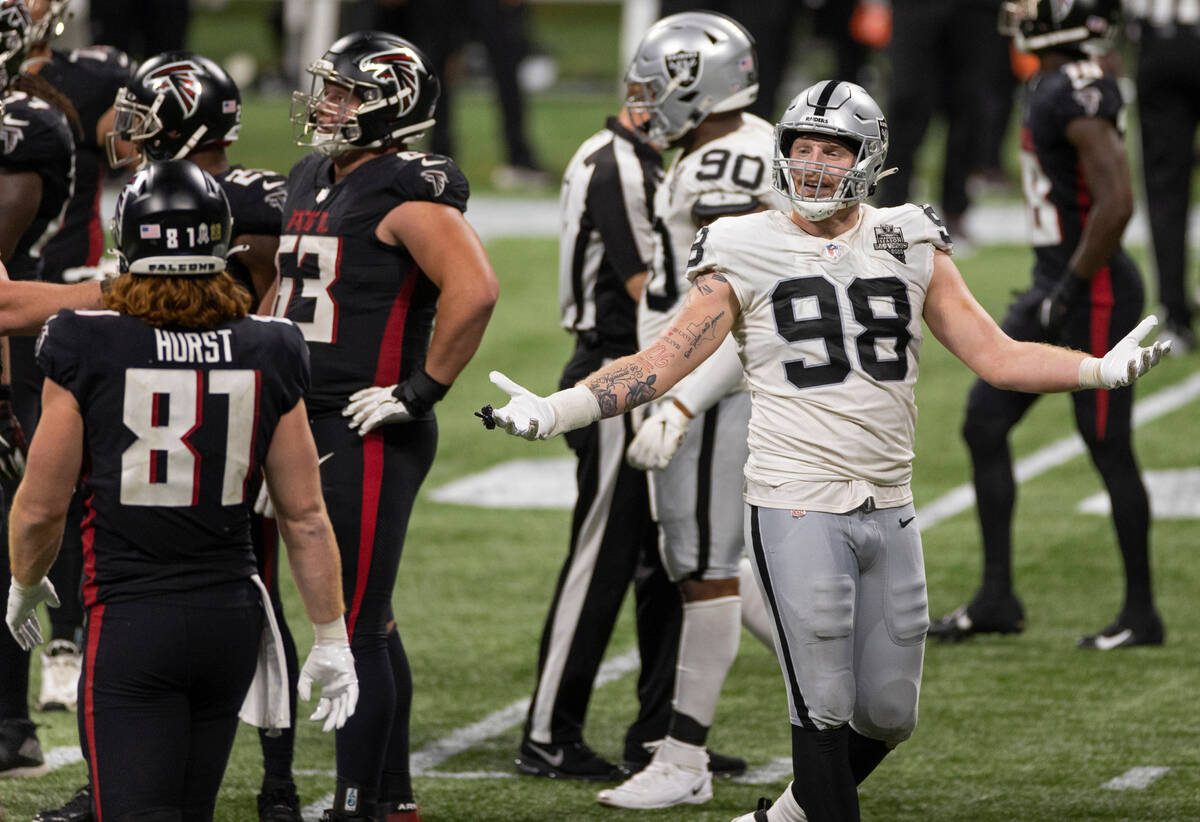 Las Vegas Raiders defensive end Maxx Crosby (98) gestures towards the bench in frustration in t ...