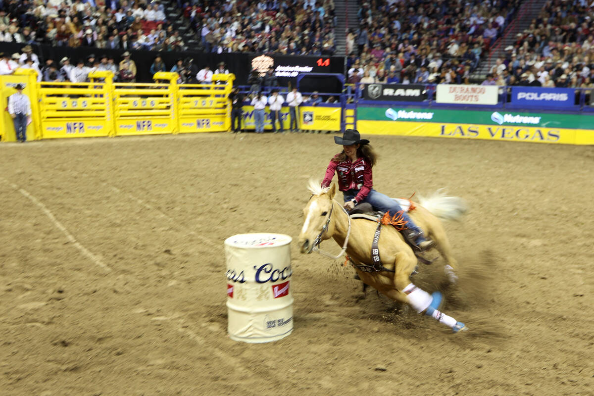 Jessica Routier competes in the barrel racing event during round 10 of the 64th Wrangler Nation ...
