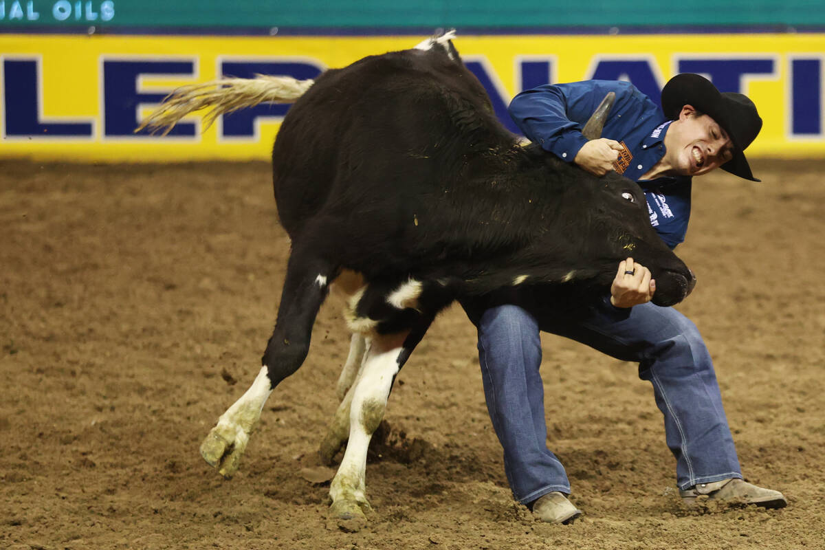 Dirk Tavenner competes in the steer wrestling event during round 10 of the 64th Wrangler Nation ...