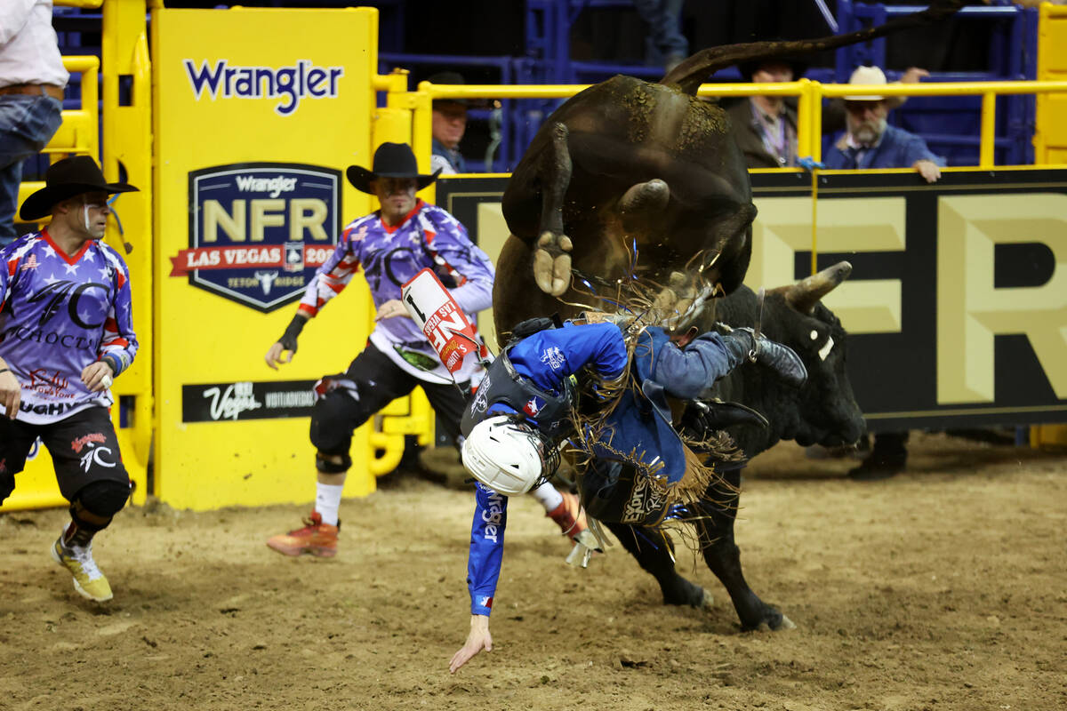Stetson Wright competes in the bull riding event during round 10 of the 64th Wrangler National ...