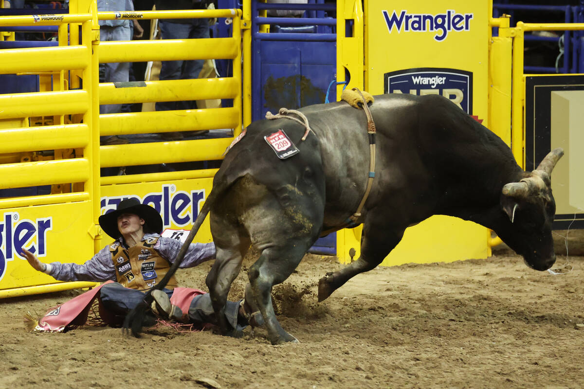 Lukasey Morris competes in the bull riding event during round 10 of the 64th Wrangler National ...