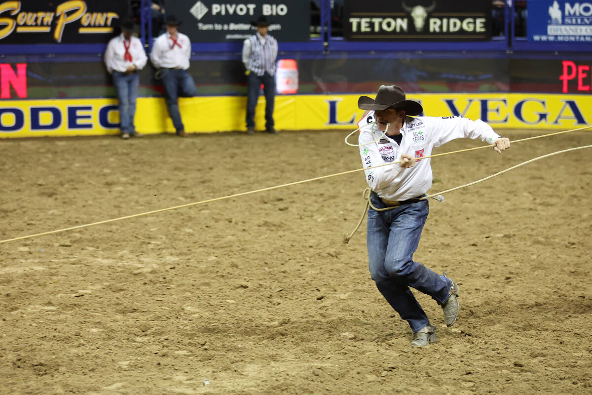 Marty Yates competes in the tie-down roping event during round 10 of the 64th Wrangler National ...