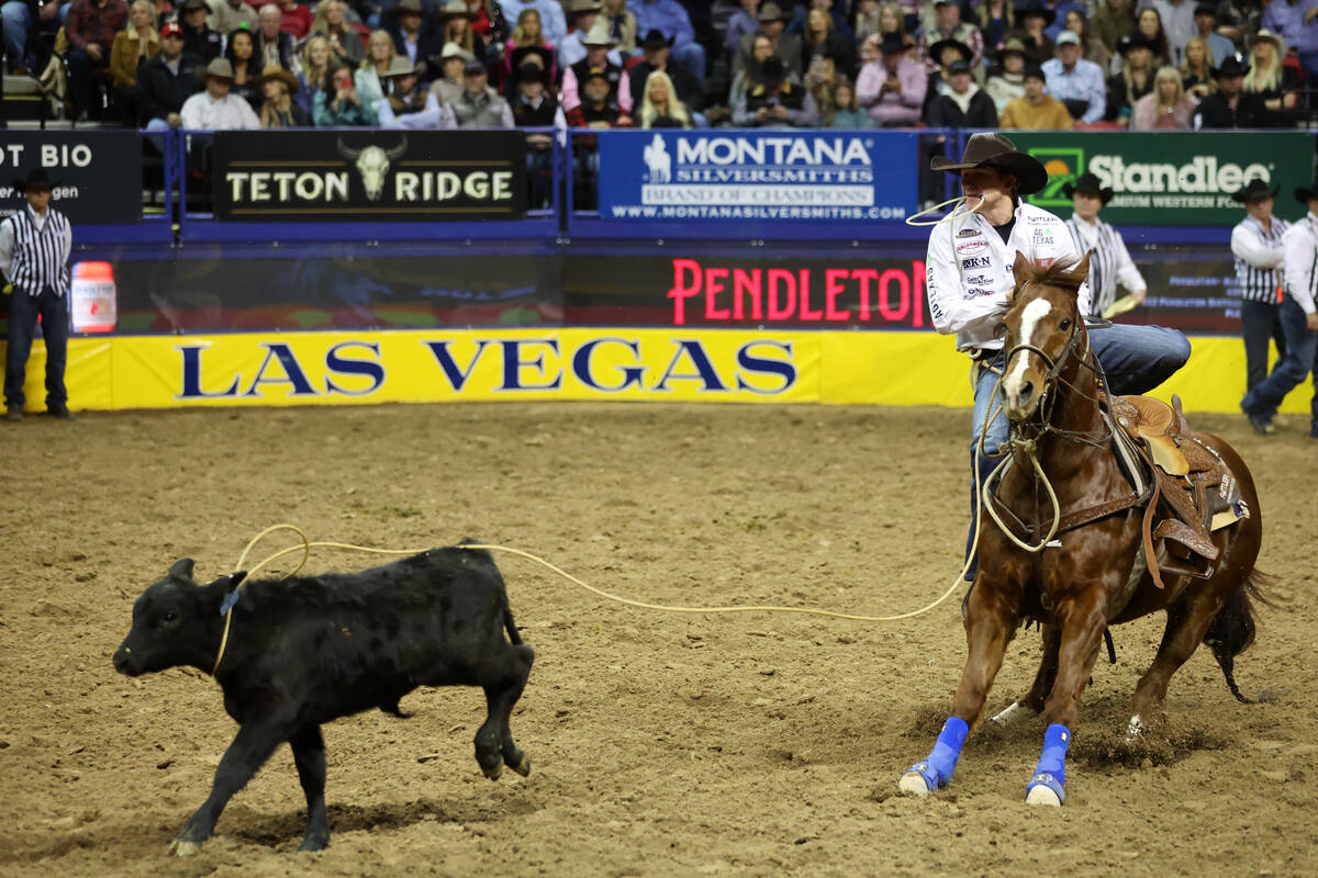Marty Yates competes in the tie-down roping event during round 10 of the 64th Wrangler National ...