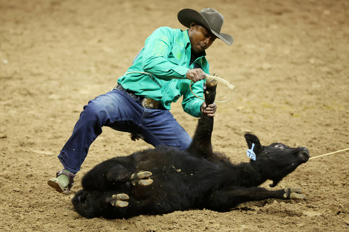 Cory Solomon competes in the tie-down roping event during round 10 of the 64th Wrangler Nationa ...