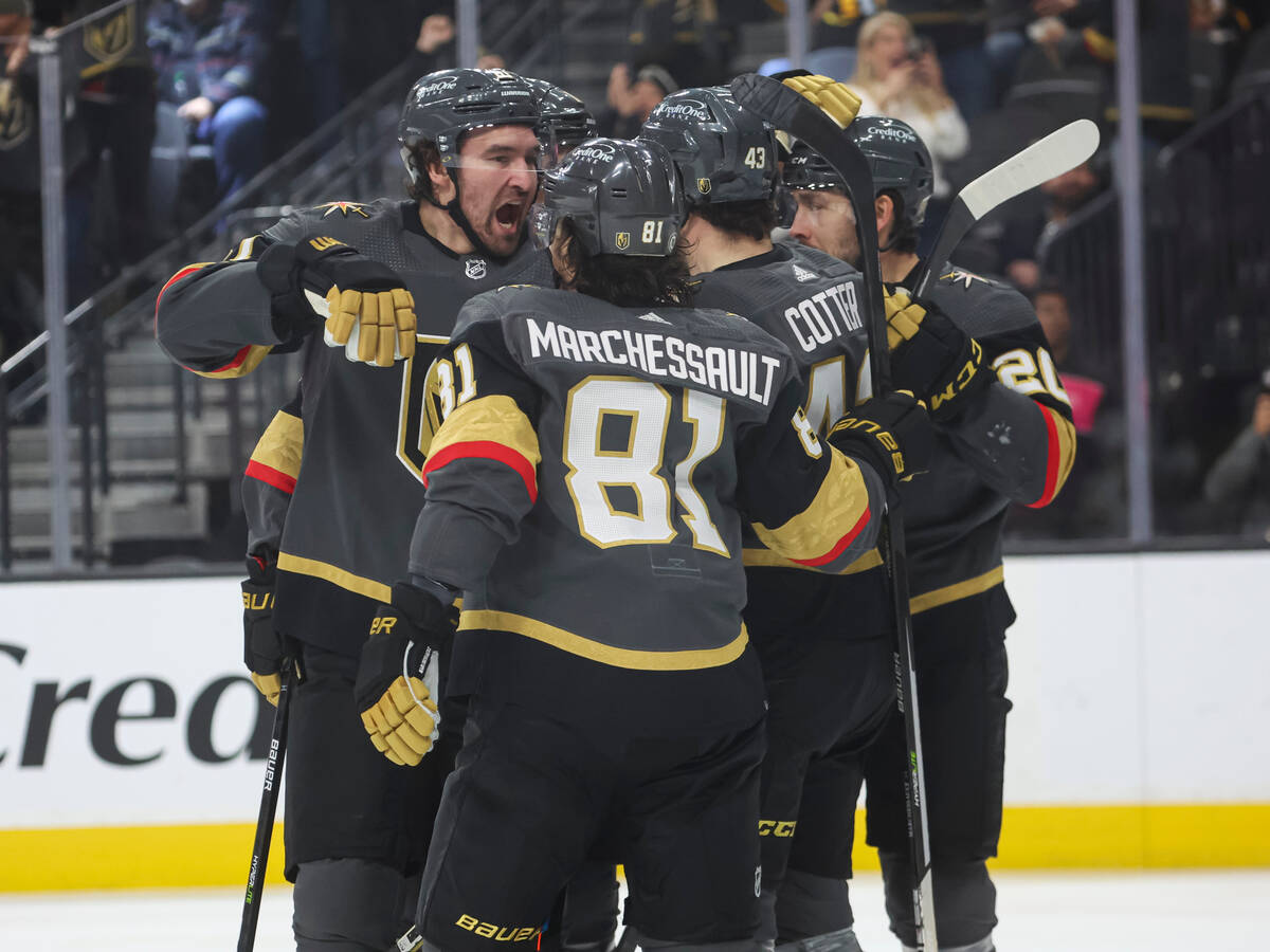 Golden Knights right wing Mark Stone, left, celebrates his goal with teammates during the first ...