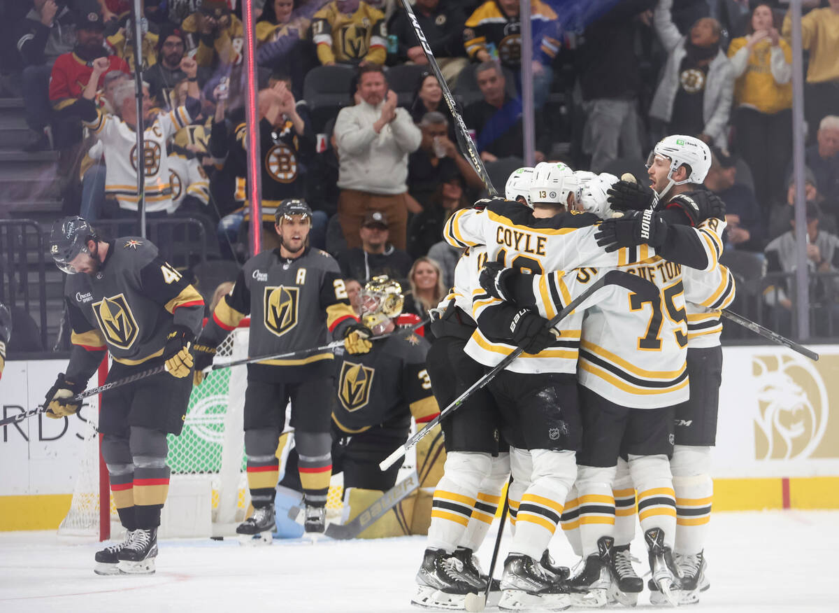 The Boston Bruins celebrate after scoring against the Golden Knights during the third period of ...