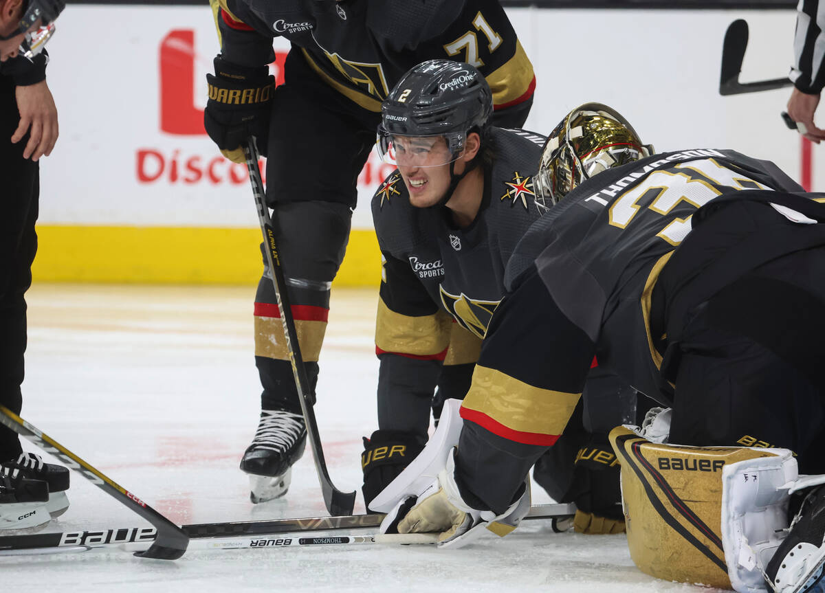 Golden Knights defenseman Zach Whitecloud (2) looks on after getting injured during the second ...