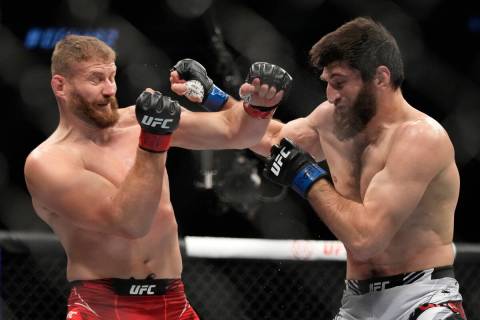 Jan Blachowicz, left, fights Magomed Ankalaev during a UFC 282 mixed martial arts light heavywe ...