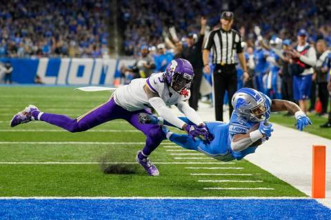 Detroit Lions' Justin Jackson runs past Minnesota Vikings' Cameron Dantzler Sr. for a touchdown ...