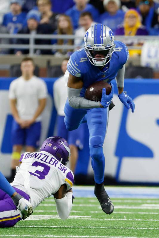 Detroit Lions wide receiver DJ Chark (4) is tackled by Minnesota Vikings cornerback Cameron Dan ...