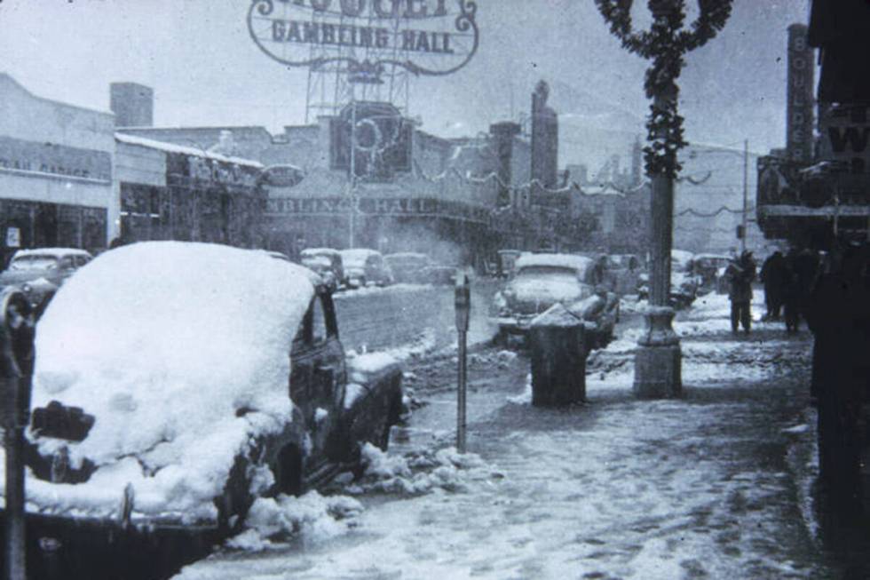 Cars covered in snow on Fremont Street in the 1930s. (Elbert Edwards Photo Collection, UNLV Spe ...