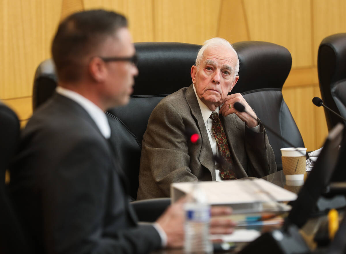 Hearing Officer William Jensen listens to Las Vegas Metropolitan Police Department Detective Ma ...