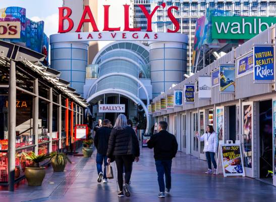 Visitors walk about the the Grand Bazaar Shops outside Horseshoe Las Vegas (formerly Bally's), ...