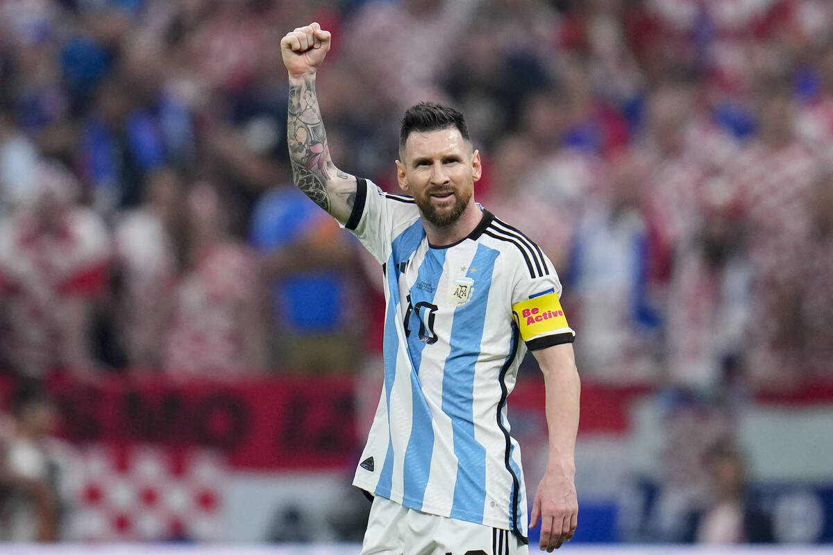 Argentina's Lionel Messi celebrates after scoring from the penalty spot the opening goal during ...