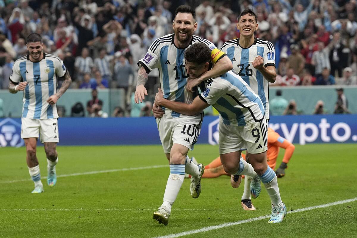 Argentina's Lionel Messi, left, and Argentina's Julian Alvarez celebrate after scoring during t ...