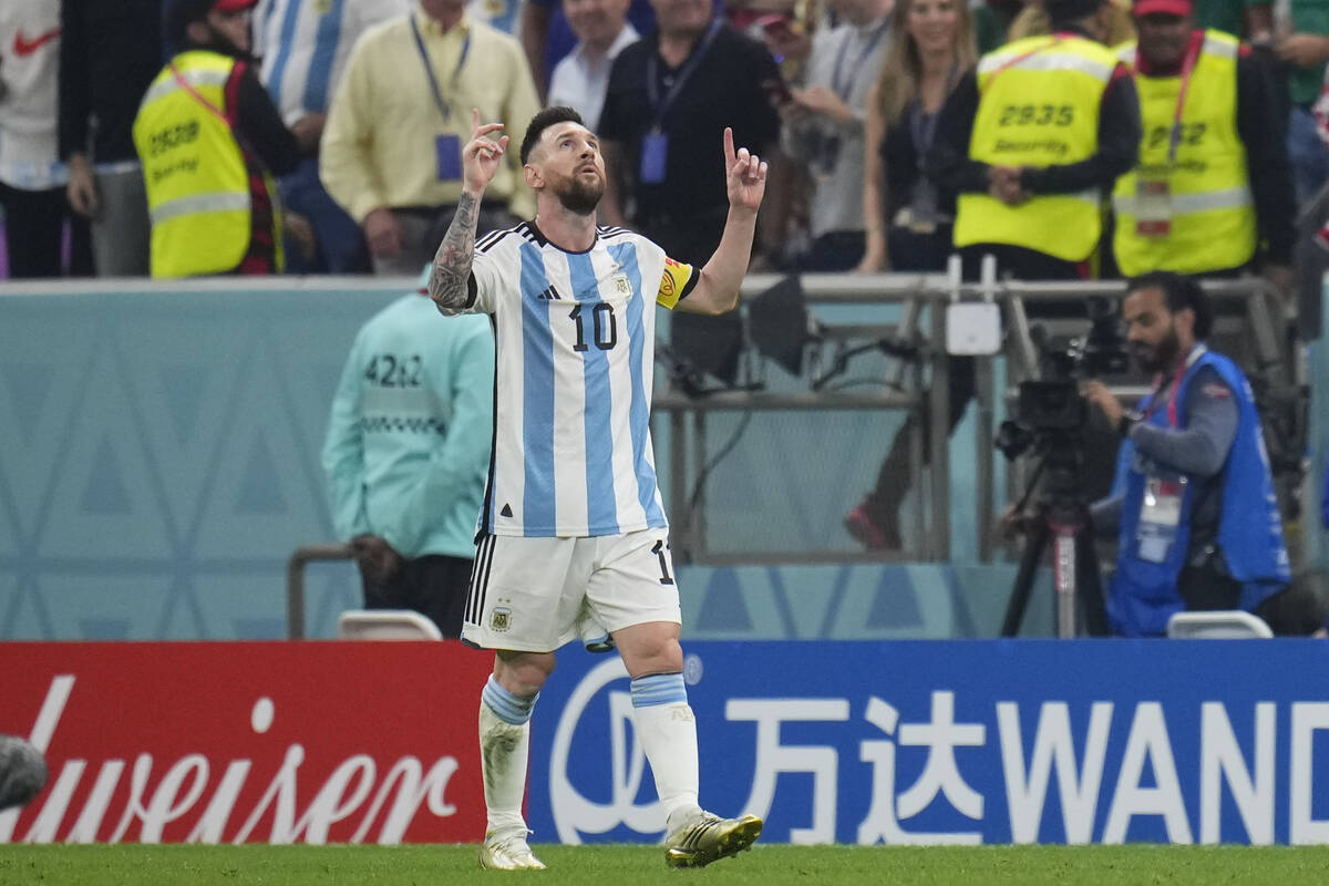 Argentina's Lionel Messi celebrates after he scored during the World Cup semifinal soccer match ...