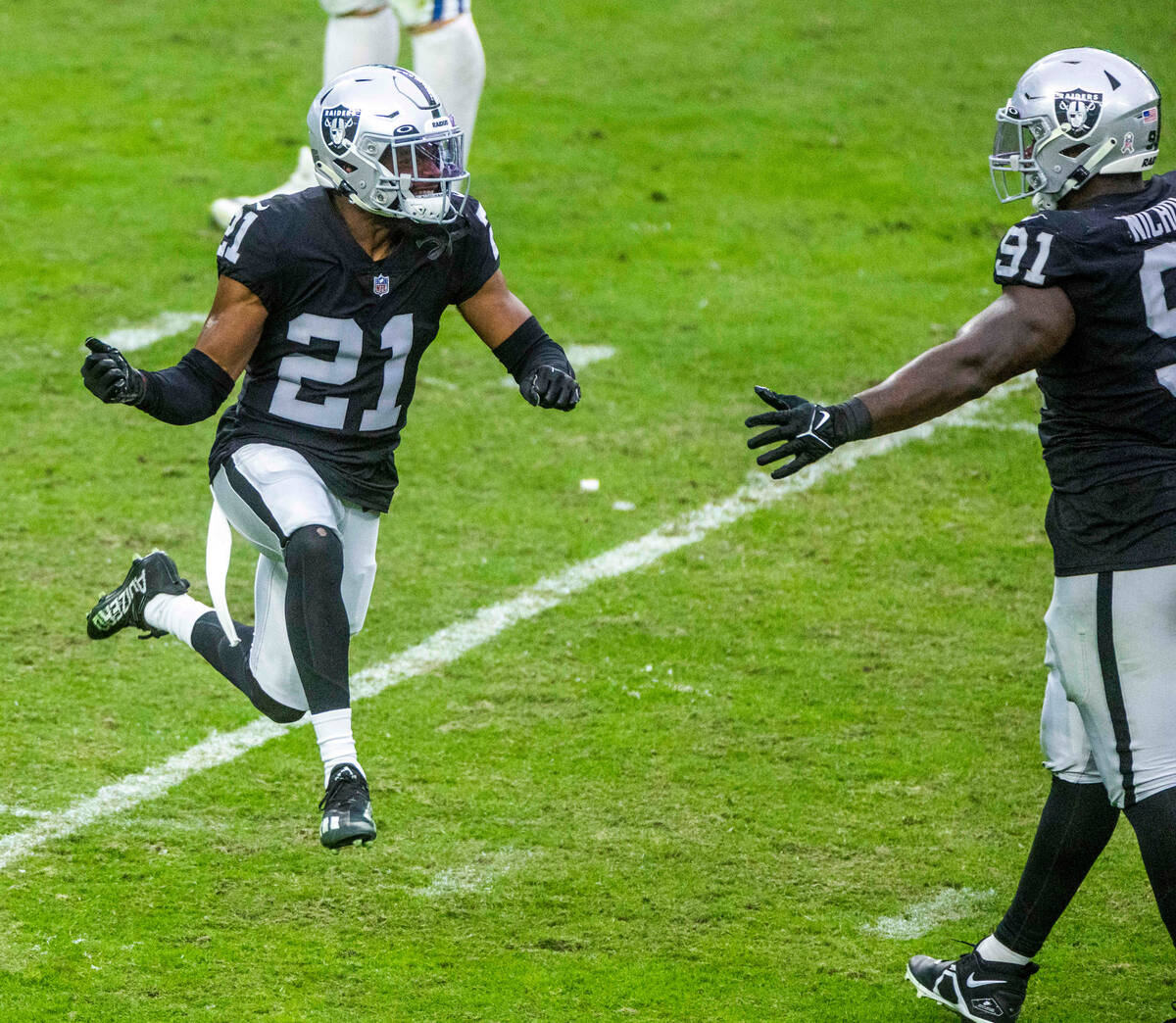 Raiders cornerback Amik Robertson (21) celebrates his big hit with an Indianapolis Colts wide r ...