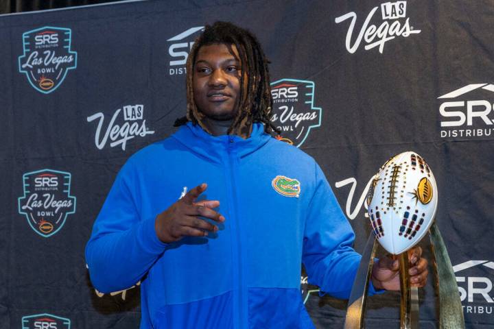 Florida Gators defensive lineman Gervon Dexter Sr., about the Rossi Ralenkotter trophy on displ ...