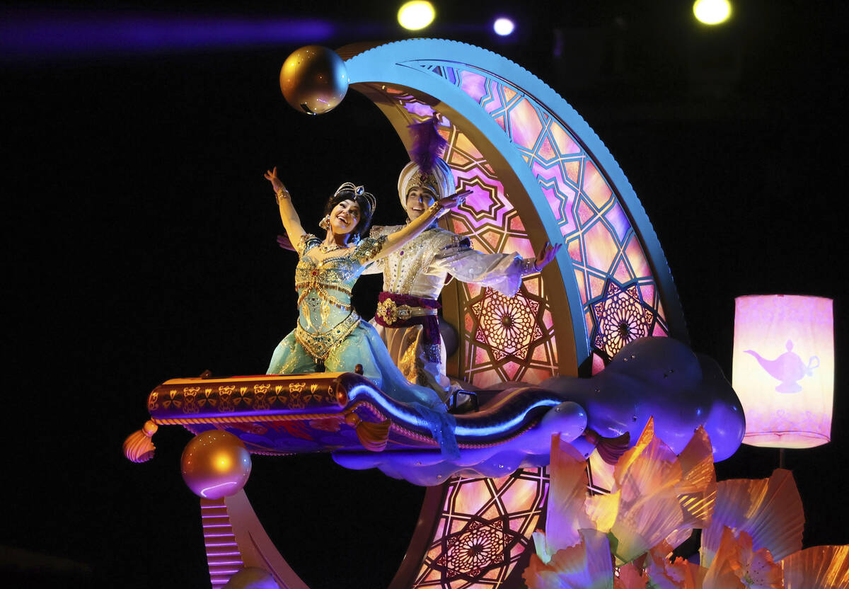 Disney characters perform on a float on the water at a press preview of the new night attractio ...
