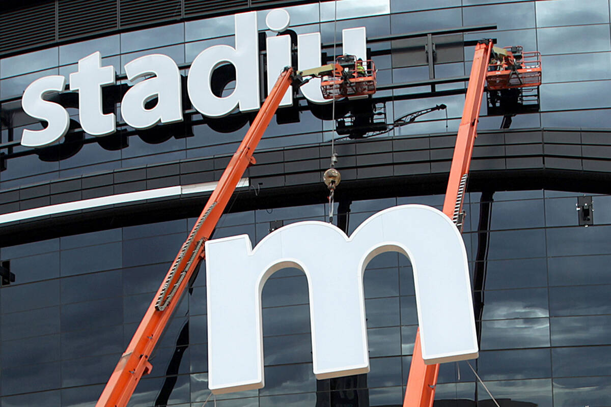 FILE - The last letter in the signage for the Raiders Allegiant Stadium logo is installed, in L ...