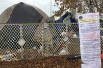 FILE - In this Jan. 8, 2018, file photo, signs warning homeless residents they'll need to move ...
