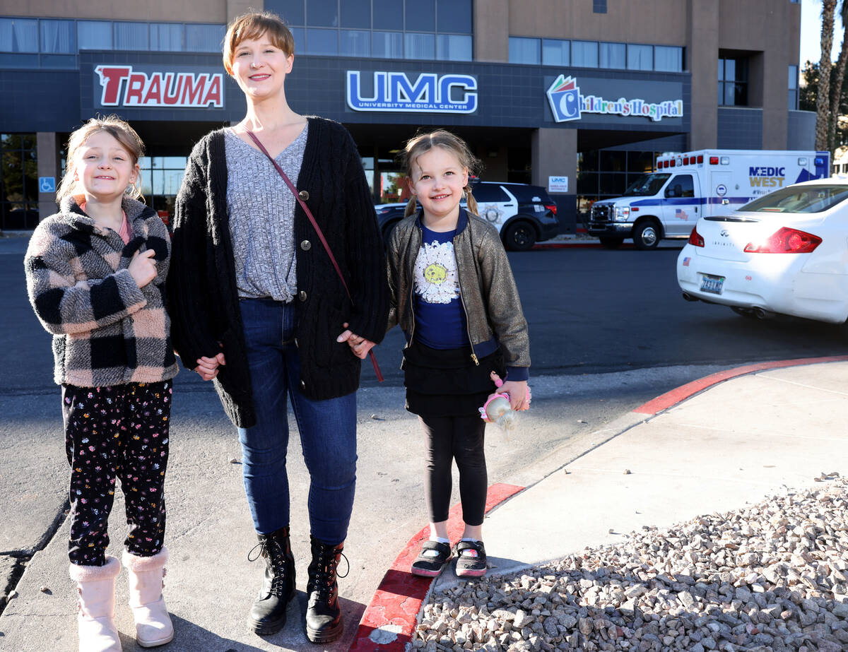 Jaimie Woodworth with her children Paige, 8, and Piper, 6, before a medical appointment at Univ ...