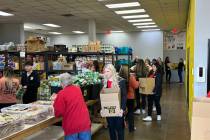 Formula One Las Vegas Grand Prix volunteers help fill holiday meal boxes for in need teenagers ...